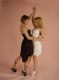 Two teen girls dancing close together